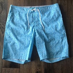 Gently used bonobos swim trunks, blue umbrella